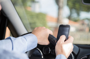 37175578 - man with mobile distracted and driving your car